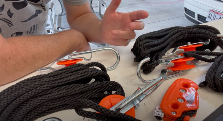 Watch The Tie Boss Block and Tackle System Hoist a 275 lbs Outboard Motor!