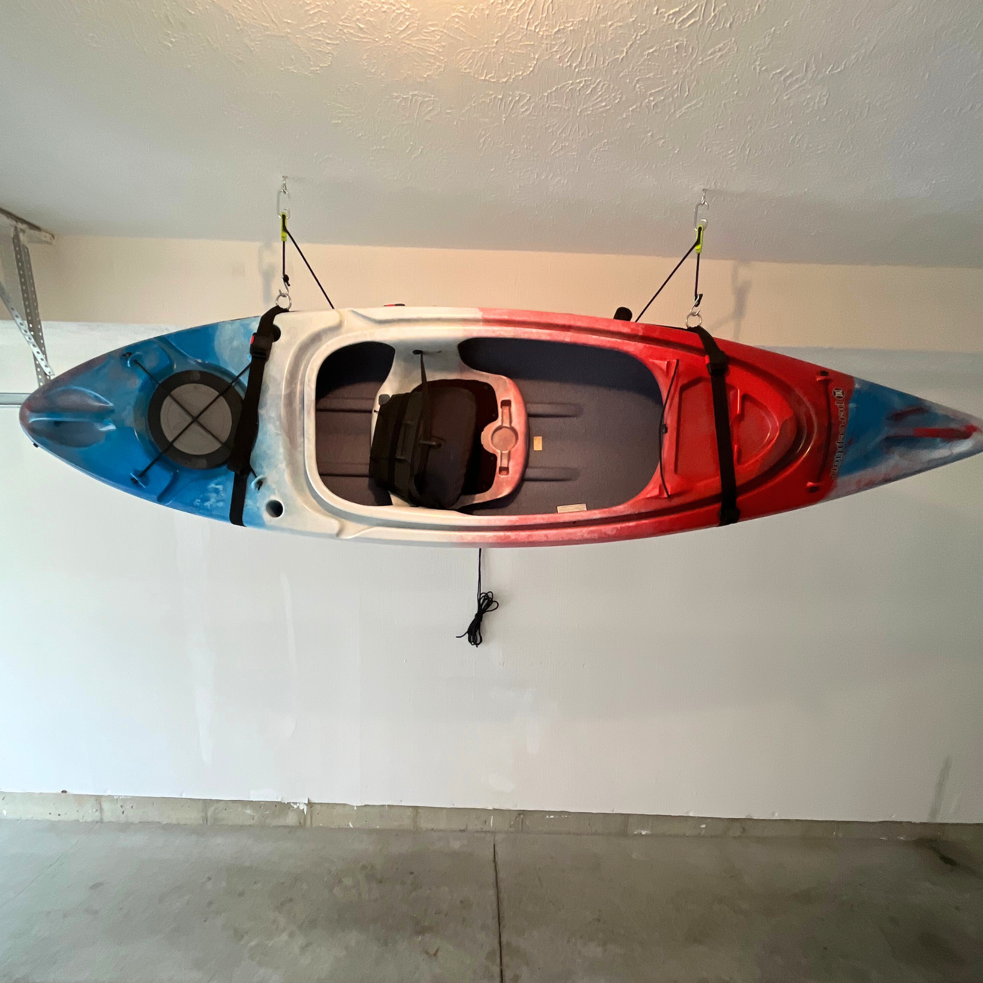 One-person kayak hoist system securing a kayak overhead